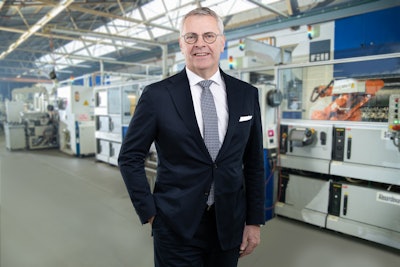 Bernd Krüper, CEO at Motorenfabrik Hatz and Hatz Components in front of a machining line for connecting rods.