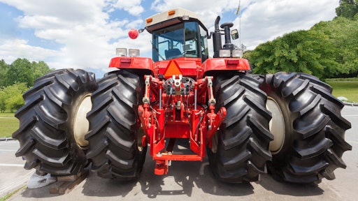 Tractor With Big Wheel And Red Metal Element On Back 5f861c49876cd