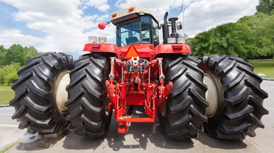 Tractor With Big Wheel And Red Metal Element On Back 5f861c49876cd