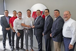 Motion and Gates officers at the award presentation (Left to right: Scott Wright, Gates; Chris Brewer, Joe Limbaugh and Kevin Storer with Motion; Grant Gawronski, Lou Rosen and Mark Guner with Gates; and Robert Anaforian, Motion)