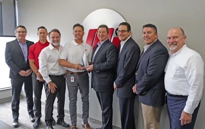 Motion and Gates officers at the award presentation (Left to right: Scott Wright, Gates; Chris Brewer, Joe Limbaugh and Kevin Storer with Motion; Grant Gawronski, Lou Rosen and Mark Guner with Gates; and Robert Anaforian, Motion)