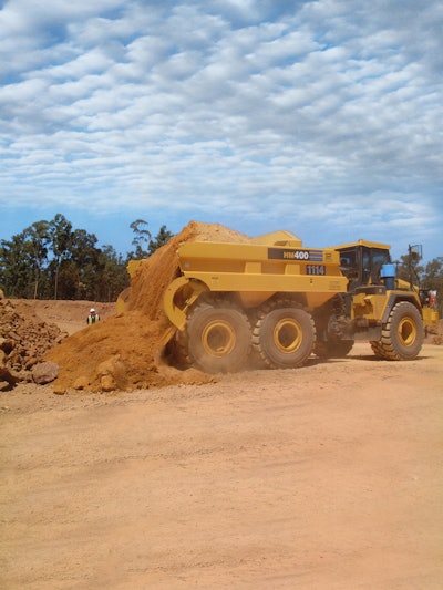 Rear eject bodies use an ejector blade to discharge material. This simplifies the dumping process and enhances efficiency.