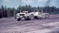 Image 1. A Euclid TDT series twin-power scraper’s extra power helped it take a healthy load of clay on the Massachusetts Turnpike in 1956.
