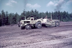Image 1. A Euclid TDT series twin-power scraper’s extra power helped it take a healthy load of clay on the Massachusetts Turnpike in 1956.