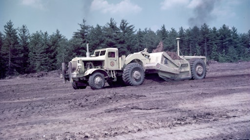 Image 1. A Euclid TDT series twin-power scraper’s extra power helped it take a healthy load of clay on the Massachusetts Turnpike in 1956.