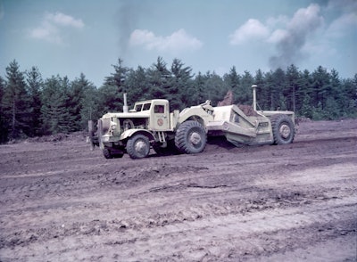 Image 1. A Euclid TDT series twin-power scraper’s extra power helped it take a healthy load of clay on the Massachusetts Turnpike in 1956.