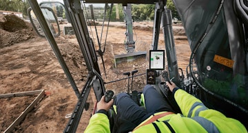 Image 1. An operator takes advantage of digital technology on a construction site.