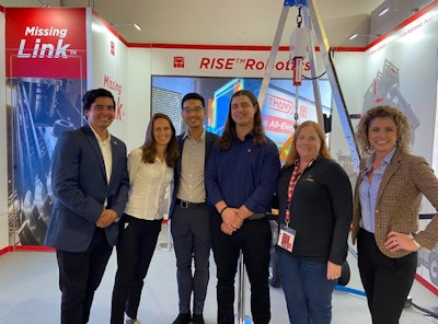 Editor Lori Ditoro with the Rise Robotics team