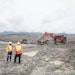 Two Mine Workers Having A Conversation Next To Machines (lube Expert Indonesia 2017) Source Photographic Services, Shell International Limited