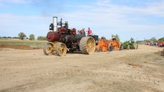 Who needs diesel engines and hydraulics, anyway? A 1918 Russell & Company 30/90 traction engine owned by Jim Lashaway of Bowling Green, Ohio, pulls two 1920 Baker Maney D wheeled scrapers and a 1929 Galion Leaning Wheel E-Z Lift No. 10 pull grader from the museum’s collection.
