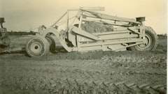 Not all of LeTourneau’s telescopic scrapers were unusually large. This Model LU Carryall has only an 11-yard heaped capacity, but this image shows the significant effect of the loading of the first of two buckets. It will soon be moved back, and the second bucket will load in its place.