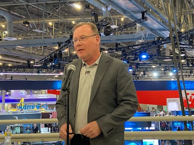 Darren Tasker, vice president, industrial sales, for Volvo Penta, shares information during the CONEXPO press conference with Gradall