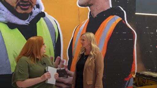 Lori Ditoro discusses Caterpillar's aftermarket benefits with Jessica Robertson, aftermarket sales manager.