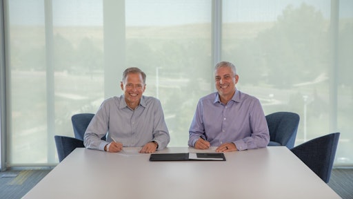 Trimble President & CEO Rob Painter (left); AGCO Chairman, President & CEO Eric Hansotia (right).