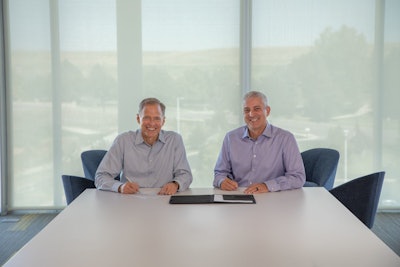 Trimble President & CEO Rob Painter (left); AGCO Chairman, President & CEO Eric Hansotia (right).