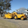 A John Deere 840 tractor and Hancock elevating scraper on parade at an equipment “rally” in Jondaryan, Queensland, Australia, in 2008.