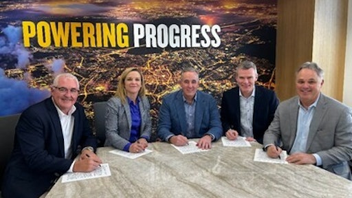 Executives from CRH sign the agreement with Caterpillar Group President Denise Johnson at the company’s headquarters in Irving, Texas.