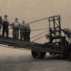 Hello, OSHA? Stroud demonstrated the superior balance of its graders by gathering 1,600 pounds worth of employees on the carrier. In operation, it would never have to bear that much weight. The grader also shows Stroud’s placement of the engine, opposite the carrier. (Stroud Road Machinery Company Bulletin 338, HCEA Archives)