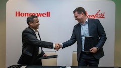 Pramesh Maheshwari, president of Honeywell Process Solutions (left) and Mika Kulju, president of Danfoss Drives (right) sign memorandum of understanding (MoU) to explore a possible collaboration on innovating automation solutions.