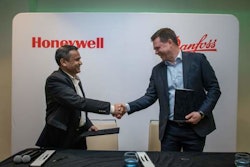 Pramesh Maheshwari, president of Honeywell Process Solutions (left) and Mika Kulju, president of Danfoss Drives (right) sign memorandum of understanding (MoU) to explore a possible collaboration on innovating automation solutions.