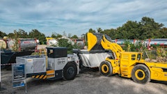 A Komatsu WXO7 LHD is shown loading a GHH MK-A20 truck at an event at GHH in Gelsenkirchen, Germany.