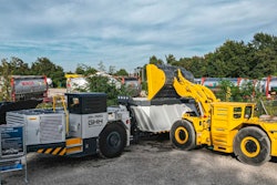 A Komatsu WXO7 LHD is shown loading a GHH MK-A20 truck at an event at GHH in Gelsenkirchen, Germany.