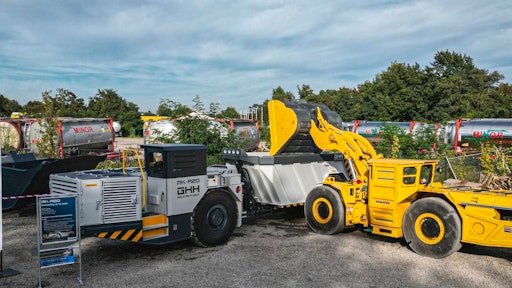 A Komatsu WXO7 LHD is shown loading a GHH MK-A20 truck at an event at GHH in Gelsenkirchen, Germany.