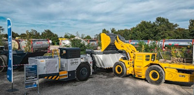A Komatsu WXO7 LHD is shown loading a GHH MK-A20 truck at an event at GHH in Gelsenkirchen, Germany.