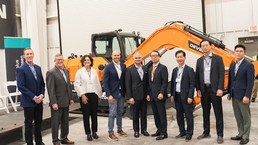 Representatives from Wallenius Wilhelmsen and leadership from HD Hyundai group / DEVELON celebrate the opening of the new customization plant in Brunswick, Georgia.
