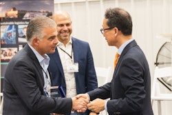 Wallenius Wilhelmsen COO of Logistics Services John Felitto (l) and Senior Vice President of High & Heavy Services Americas Mike Rye (c) congratulate HD Hyundai XiteSolution President and CEO Young Cheul Cho on the opening of the new HD Hyundai North American Customization Center.