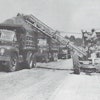 Figure 1: One advantage of a motor grader/EGA outfit was that it required only one operator. But in some loading situations, a spotter rode out on the parent’s frame to direct hauler traffic, somewhat negating the labor savings. Courtesy: Ulrich Manufacturing Company Form 1231, n. d., HCEA Archives