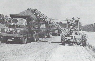 Figure 1: One advantage of a motor grader/EGA outfit was that it required only one operator. But in some loading situations, a spotter rode out on the parent’s frame to direct hauler traffic, somewhat negating the labor savings. Courtesy: Ulrich Manufacturing Company Form 1231, n. d., HCEA Archives