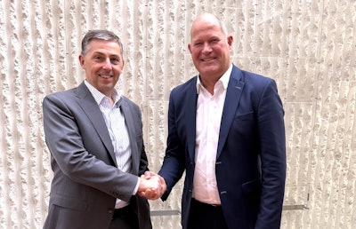 Outgoing CEMA president Thierry Krier (left) and CEMA president Stefan Top shake hands after the CEMA Board meeting.