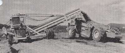 Figure 2: The closest competitor to a BV was the Sierra Loader, developed by C&D Manufacturing and acquired by P&H. Note the extra-wide gauge rear axle and the much wider working width compared to a BV. This one is loading what appears to be a Heil or early International Harvester motor scraper; ironically, advances in scraper design and size were the driving force in the obsolescence of BVs and Sierra Loaders.