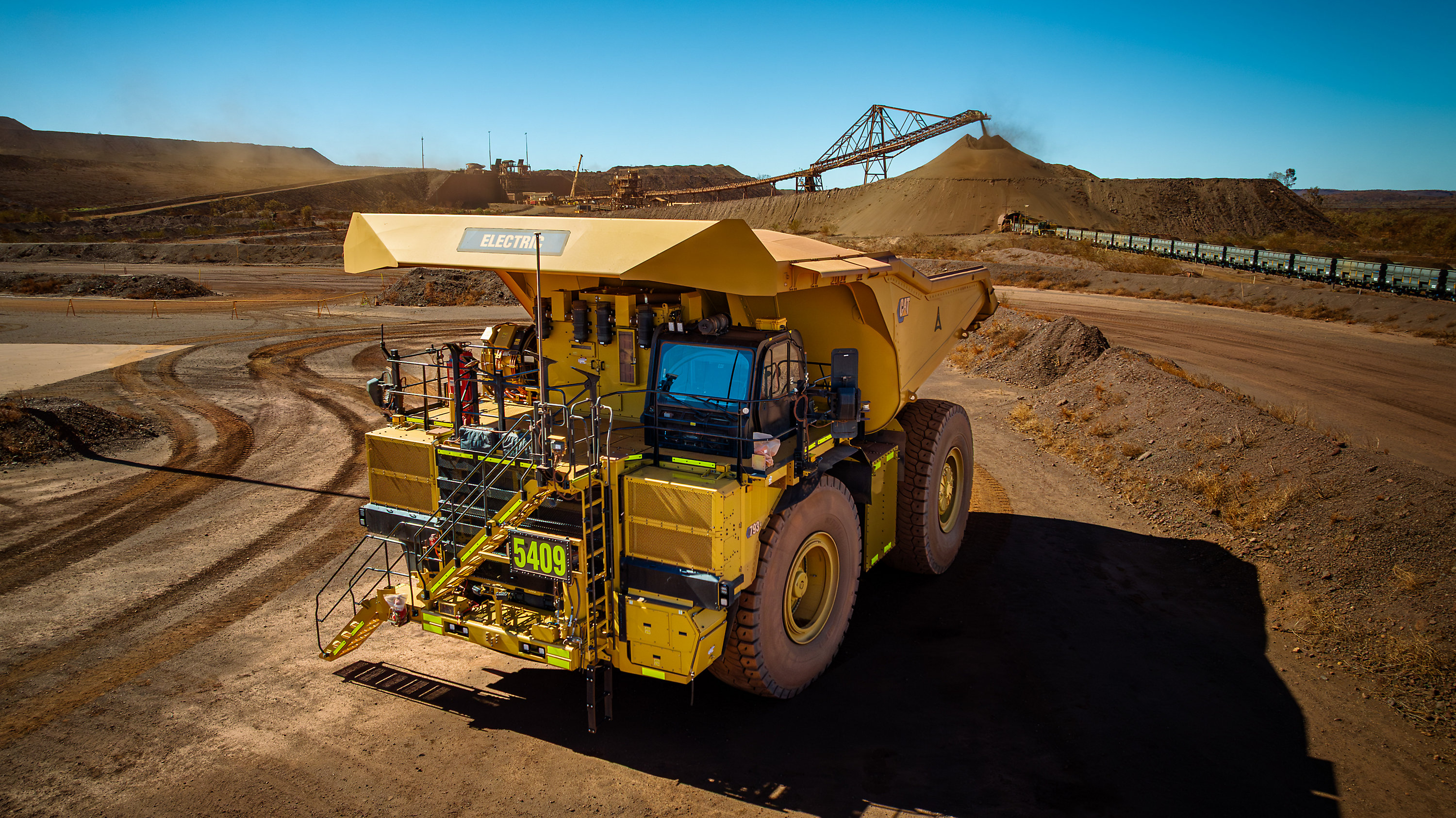 BHP, Rio Tinto and Caterpillar have launched a trial of two Cat 793 XE Early Learner battery-electric haul trucks at a mine-site demonstration in Wester Australia's Pilbara as part of an industry-first collaboration.