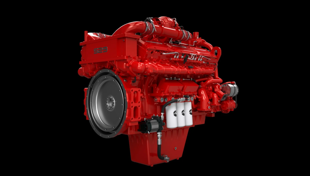 Red Cummins diesel engine with turbocharger on black background