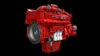 Red Cummins diesel engine with turbocharger on black background